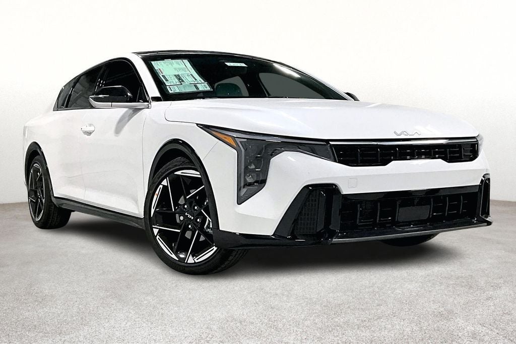 2025 Kia K4 GT-Line in Snow White Pearl — front three-quarter view